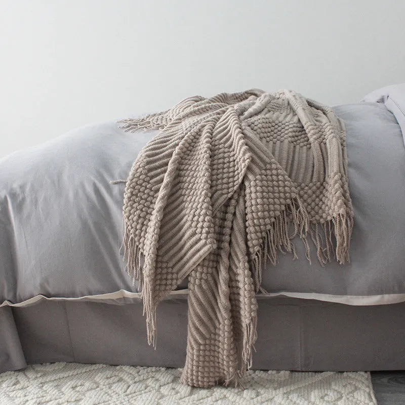 Small light grey polyester nap blanket folded, showing its 127x170cm size.