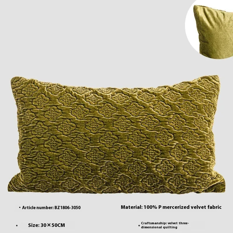 Brown gold antique style three-dimensional quilted cushion pillow on a sofa.