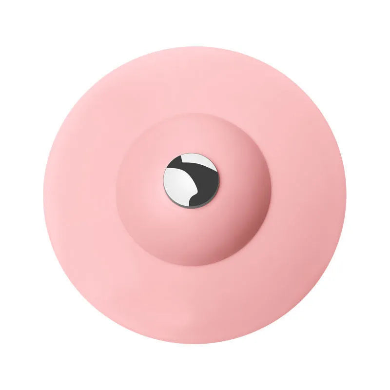 UFO-style silicone press sink drain cover in white on a modern kitchen sink