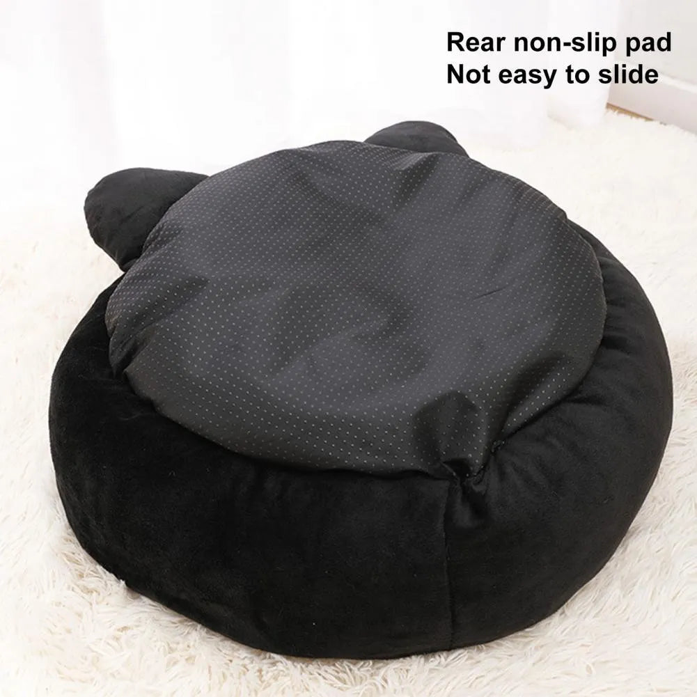 Black cat shape velvet pet nest bed with raised edges, 50cm diameter, on floor