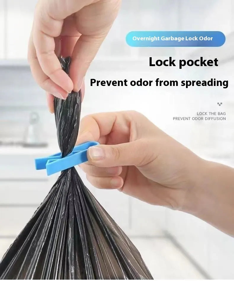 White PP plastic non-slip clip holding a black bin liner to the side of a silver kitchen trash can.