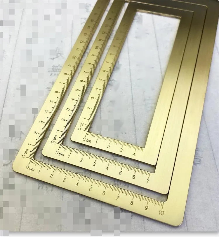 Solid brass paper weight set with engraved square design for calligraphy and writing.