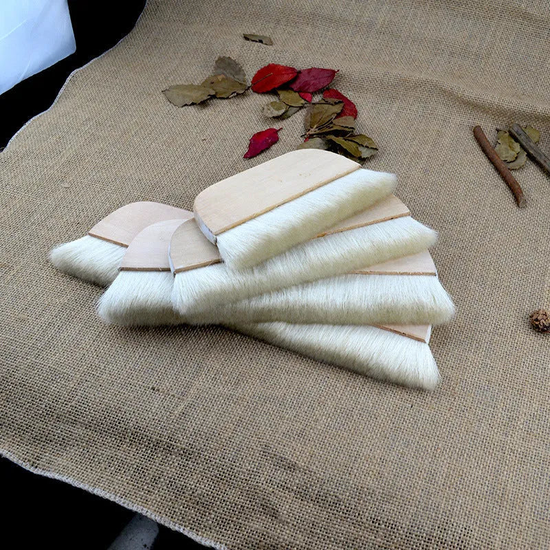Wool fibre art brush for mounting paste and shading in picture colour.