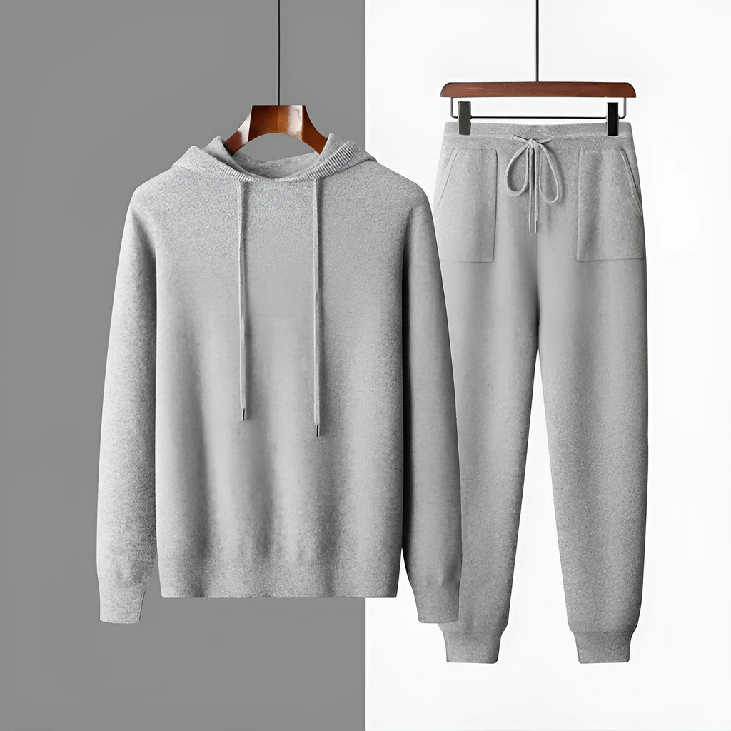 Men's light gray hooded cashmere sweatshirt and matching trousers laid flat as a set.