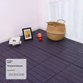 Wood grain plastic interlocking floor tile showing non-slip surface texture