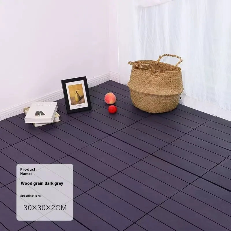 Wood grain plastic interlocking floor tile showing non-slip surface texture