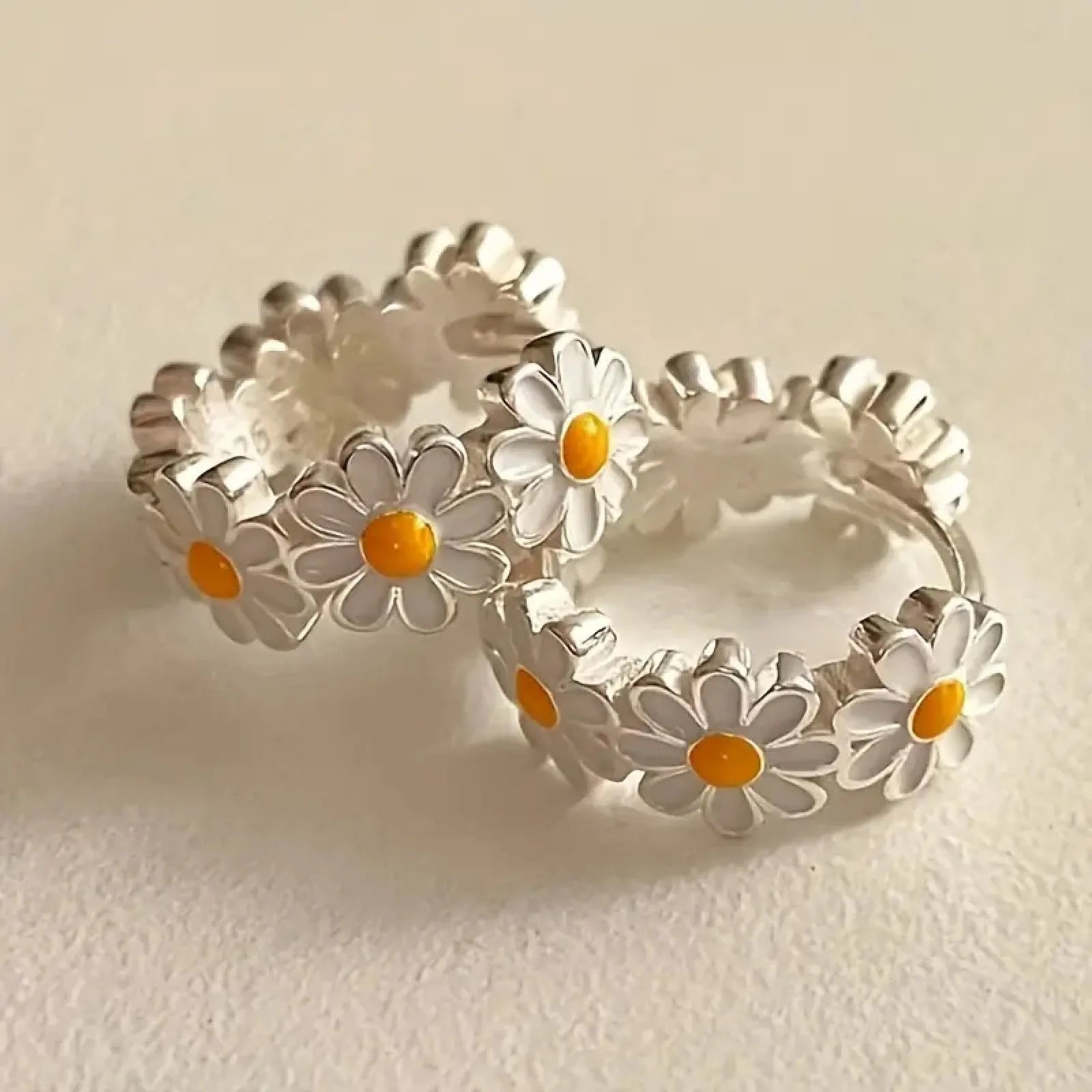 White daisy flower ring drop earrings with electroplated copper construction and platinum inlaid gem detailing