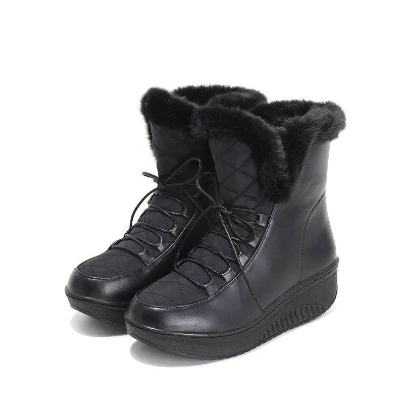 Black women's winter platform boots with lace-up front and plush lining on a white background.