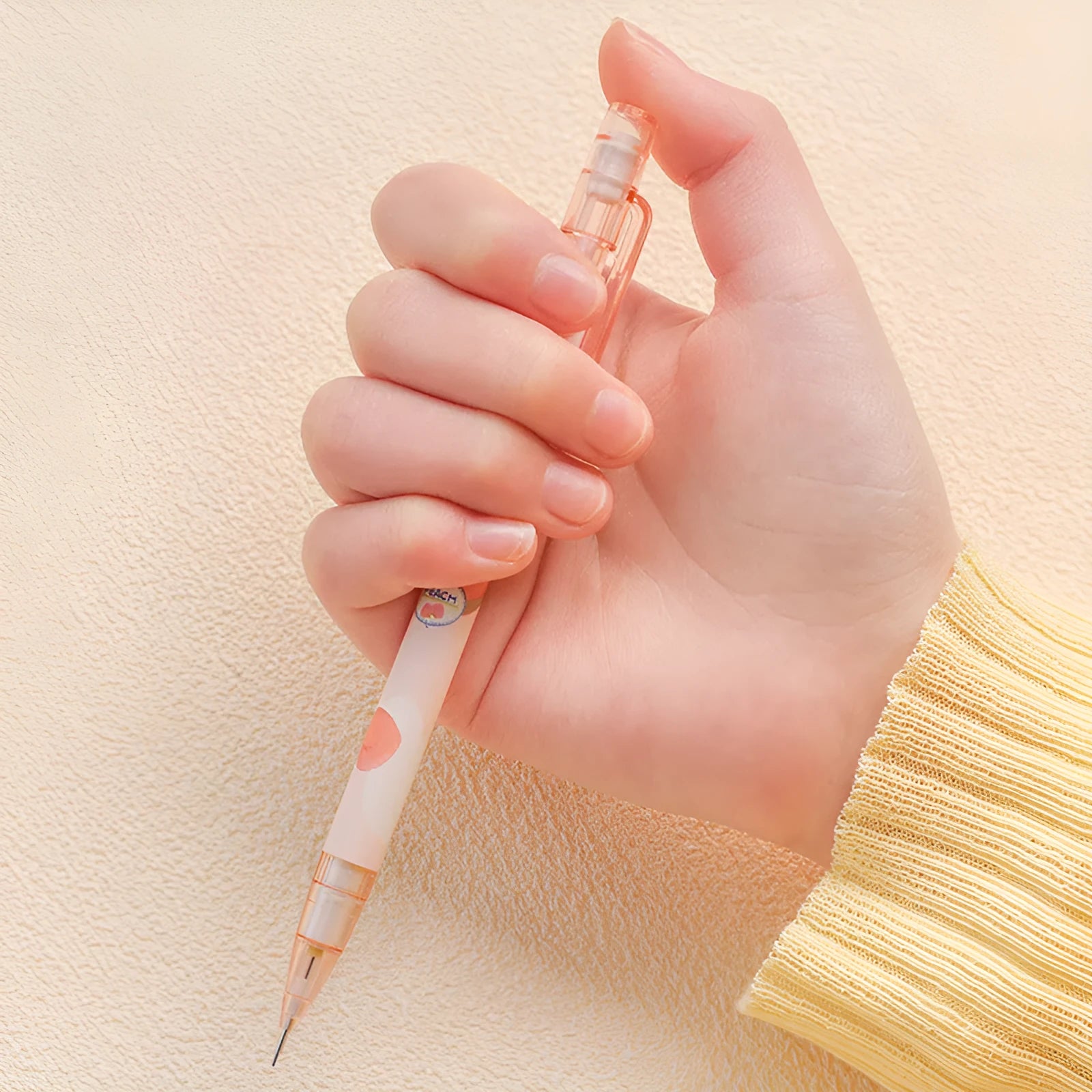 Peach plastic automatic pencil press 0.5mm lead with refills, no sharpening required