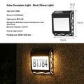Solar powered doorplate light with LED indicator in black or silver finish, measuring 180x50x200mm