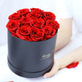 Handmade everlasting rose in hug bucket with preserved flower material, available in white red pink black blue colours