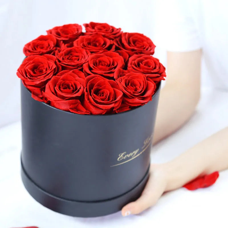 Handmade everlasting rose in hug bucket with preserved flower material, available in white red pink black blue colours