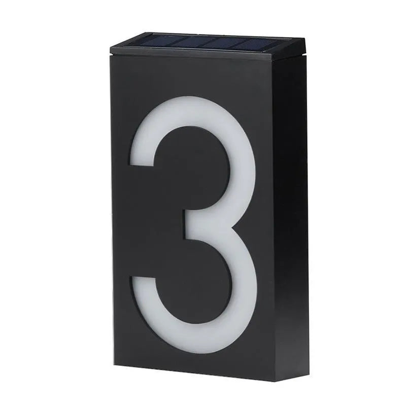 Solar powered house number light with white LEDs illuminating digit, IP65 waterproof outdoor design