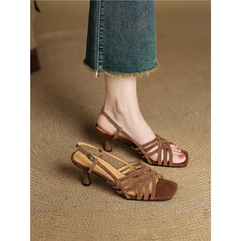 Women's light brown retro ankle-strap sandals with thin cross straps and a square toe on a mid heel.