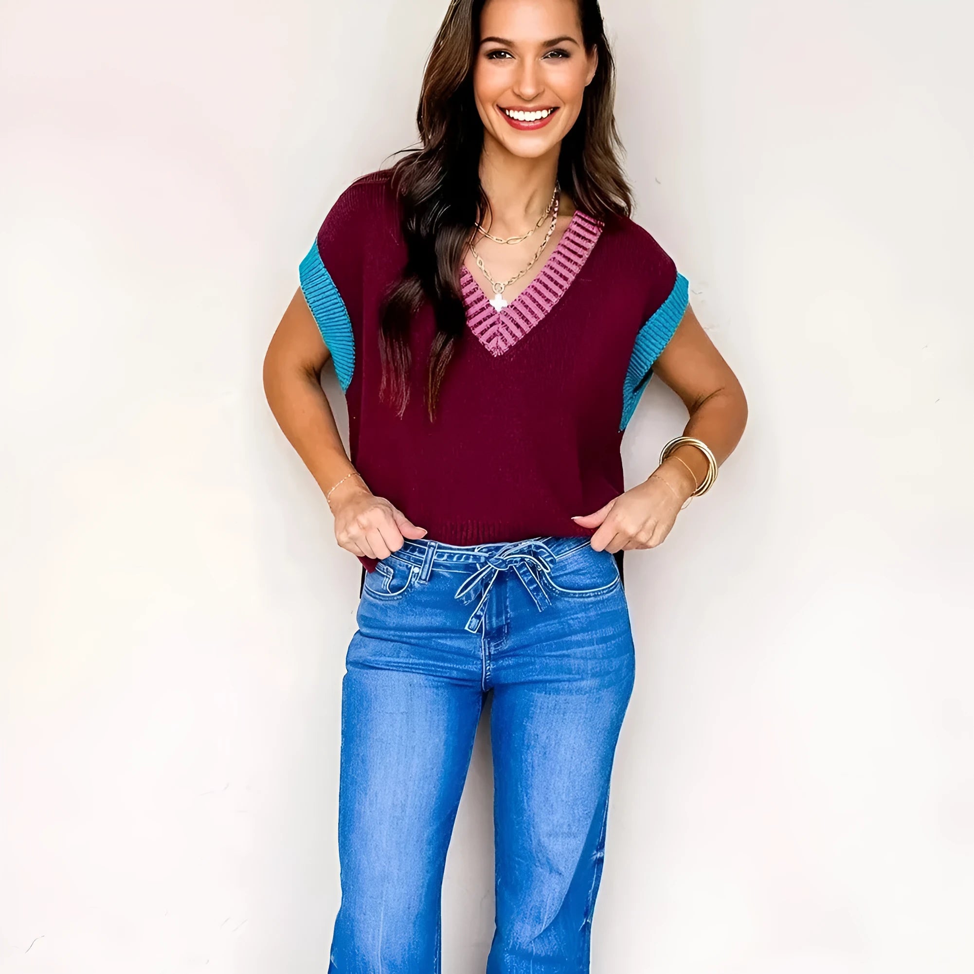 Burgundy contrast trim V neck loose sweater with cuffed short sleeves on mannequin
