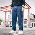 Men's loose straight casual jeans in dark blue with mid-waist fit and zipper fly