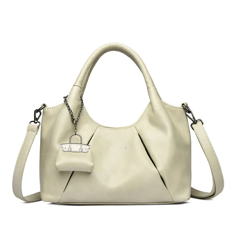 Trendy niche women's new shoulder bag in genuine leather with dumpling shape and pleated detail, khaki colour