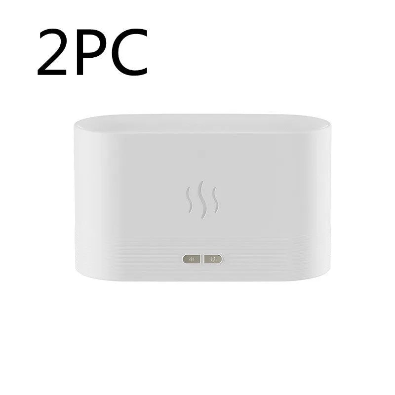 Square 180ml ultrasonic aroma diffuser with flame LED light in black, on a desk with visible mist