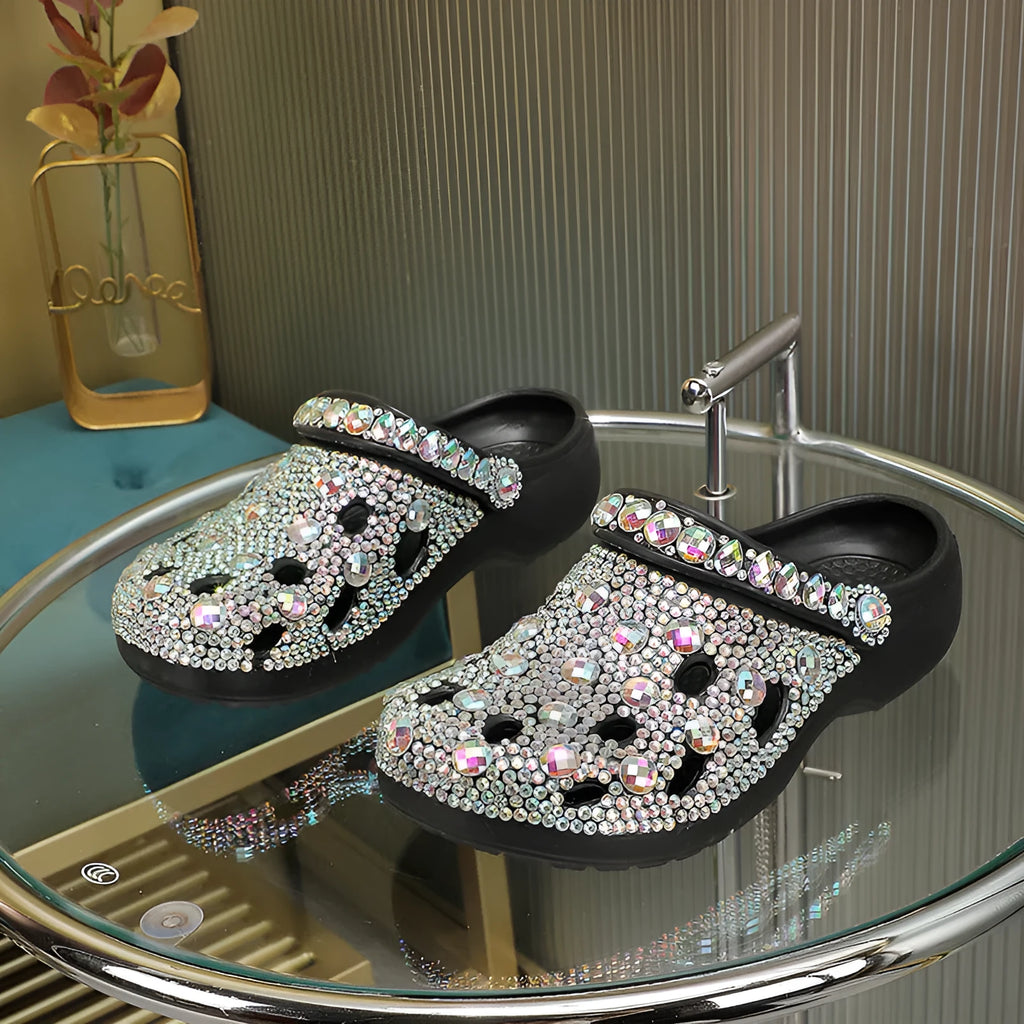 Black women's platform sandals with rhinestone details on an open hole design EVA upper.
