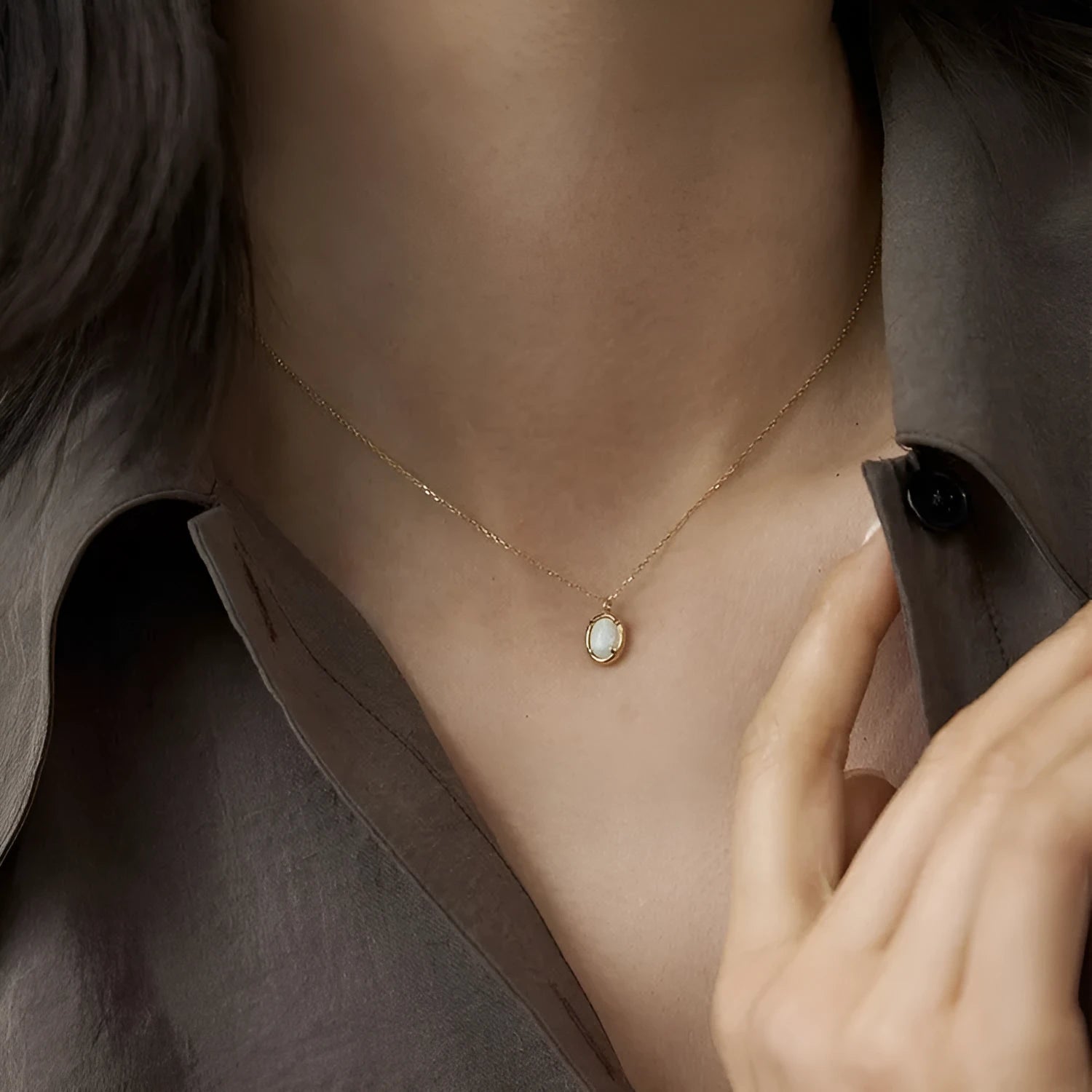 Oval jelly opal pendant necklace on a silver chain with choice of gold or white gold finish.