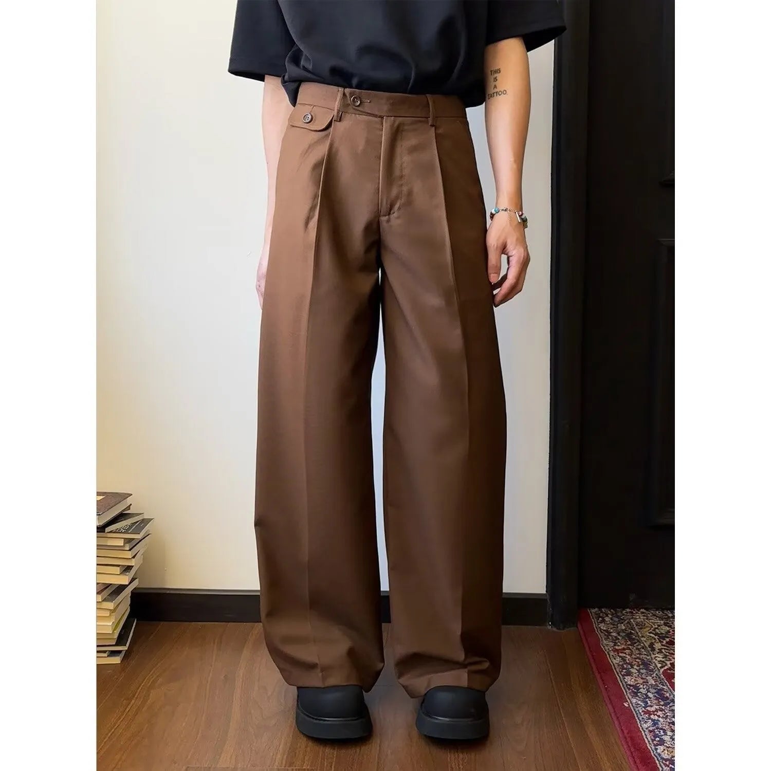 Men's brown wide-leg straight-cut casual trousers made from a polyester blend fabric on a hanger.