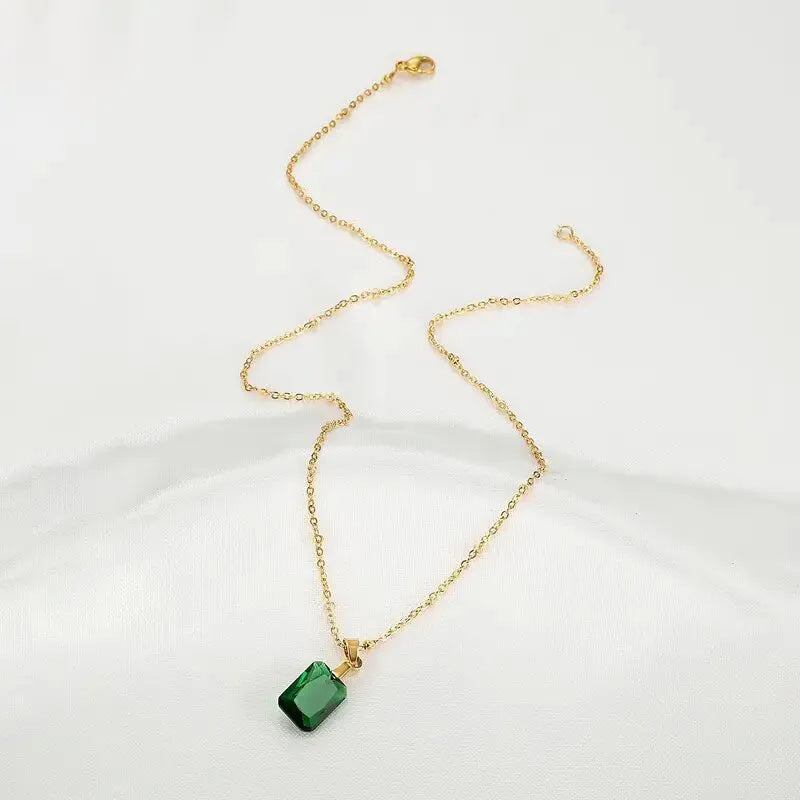 Rectangular green copper geometric pendant necklace on an O-ring chain.