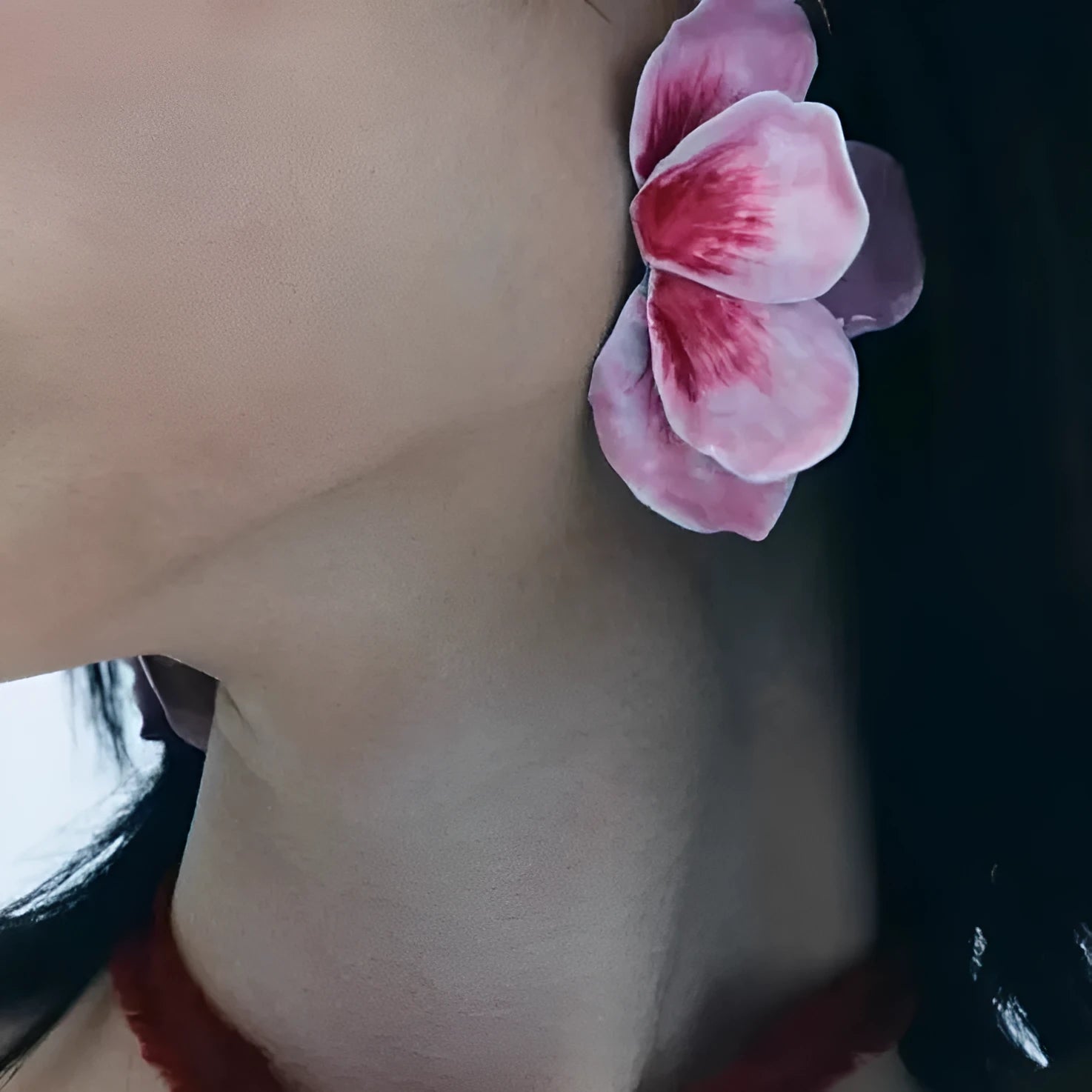Close-up of pastoral style alloy flower stud earrings with oil-spot glaze in blue, green, purple, and rose colours