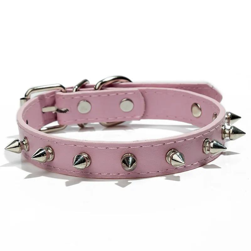 Studded dog collar in black PU leather with metal spikes and alloy buckle.