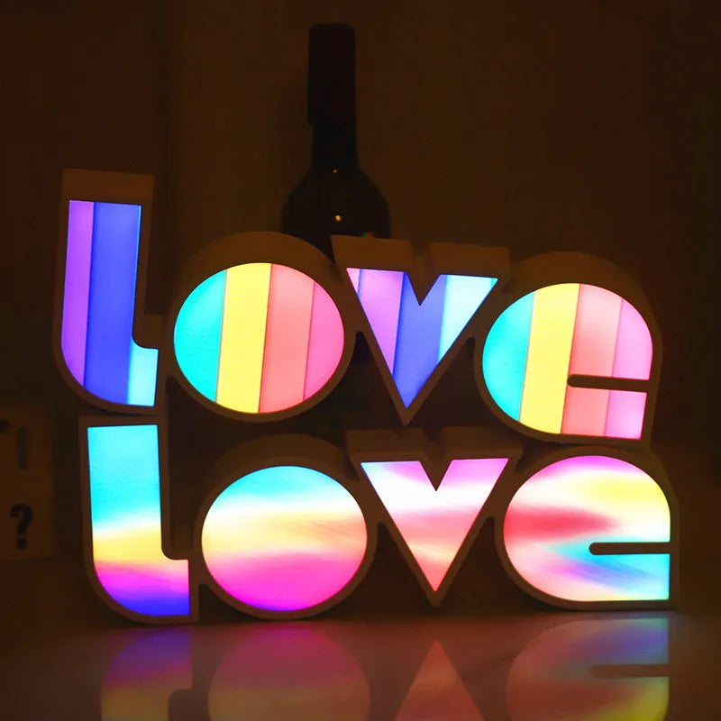 Colourful LED love light decorative lamp with plastic shell on a table