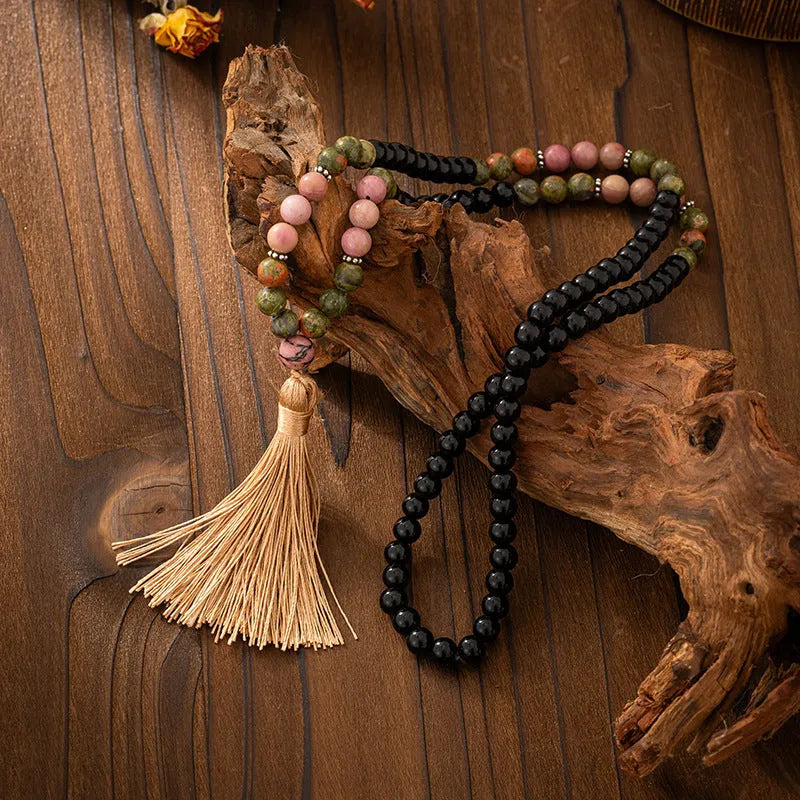 Vintage bohemian style natural stone bead necklace and bracelet set showing geometric round beads and tassel detailing