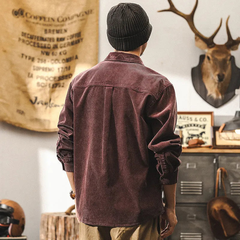 Men's black loose-fit retro corduroy shirt jacket with long sleeves.