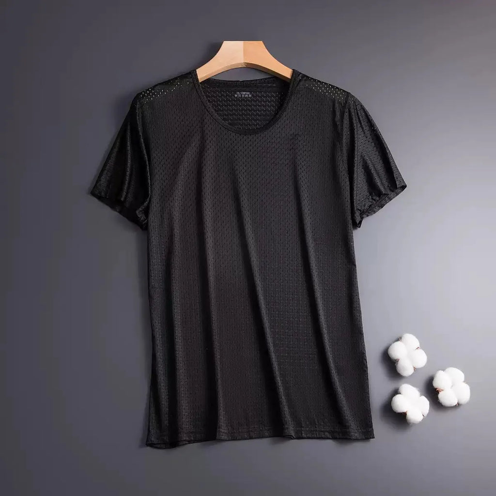 Man wearing a loose-fit grey Ice Silk short sleeve crew neck T-shirt.