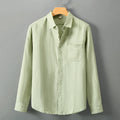 Long sleeve loose-fit linen cardigan shirt in Chinese style on a hanger