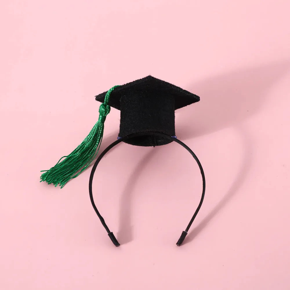 British-style Doctor's Degree elastic hair band and woolen felt bow tie set for a cat or dog, shown in yellow cap colour option.