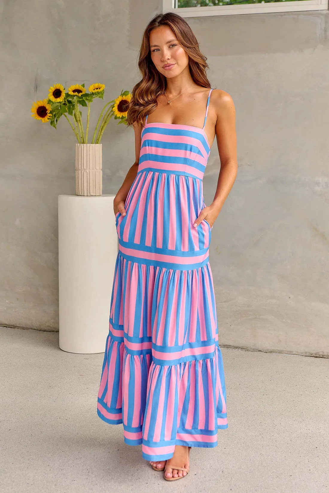 Women's striped printed summer dress with suspender straps and side pockets in blue colour