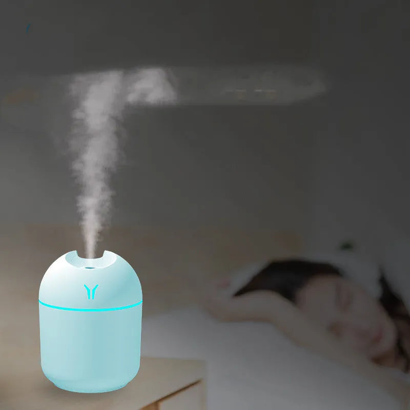 Round desktop humidifier with USB cable in ivory white, sky blue, and girlish pink colour options