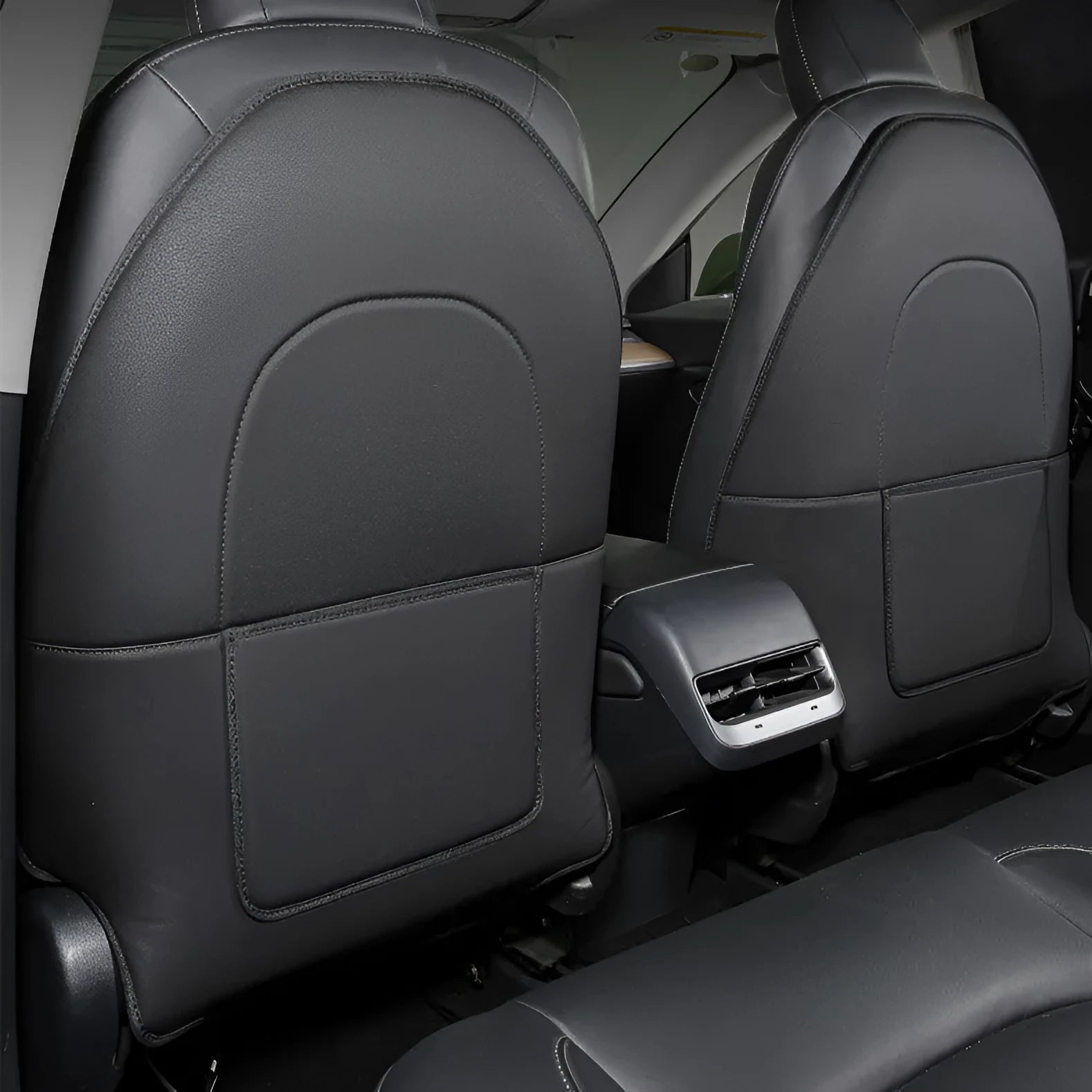 Black leather anti kick pad for car seat back protection, showing single pocket.