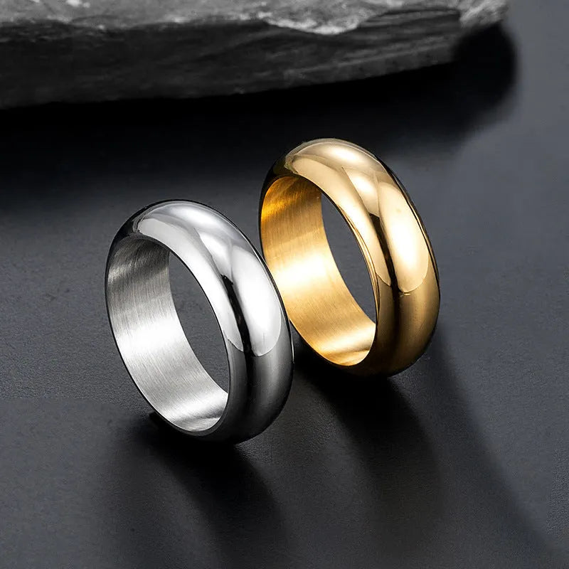 Glossy electroplated titanium steel ring in gold, black, or steel colour on a plain background.
