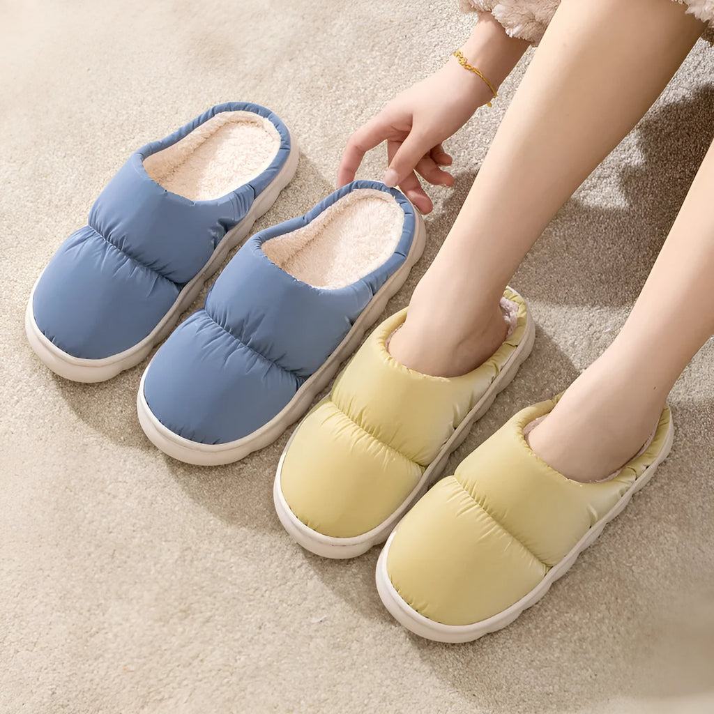 Down cotton couple slippers with artificial leather upper and non-slip rubber soles in multiple colour options