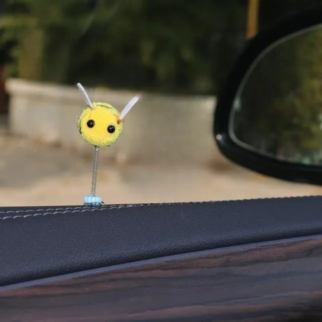 Soft fur ball bee car decoration measuring 3x3 centimetres with cartoon design
