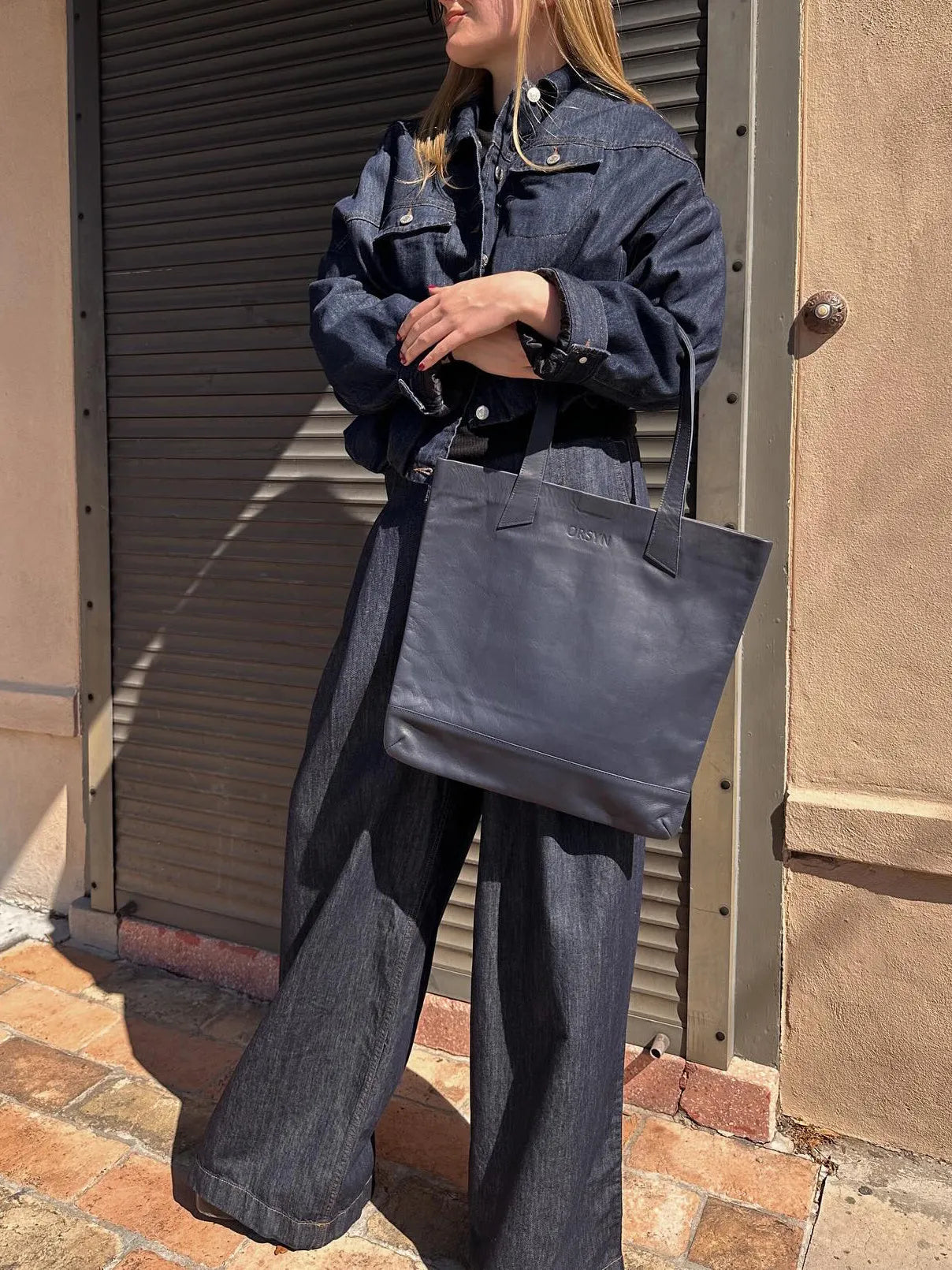 Dark denim oversized jacket and wide-leg pant set in blue, regular fit, front view