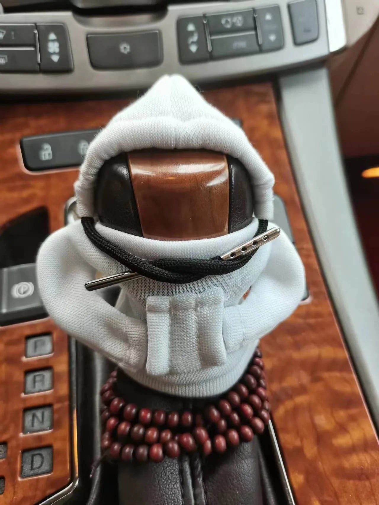 Dutch velvet car gear handle sleeve cover in multiple colours on a car gear lever.