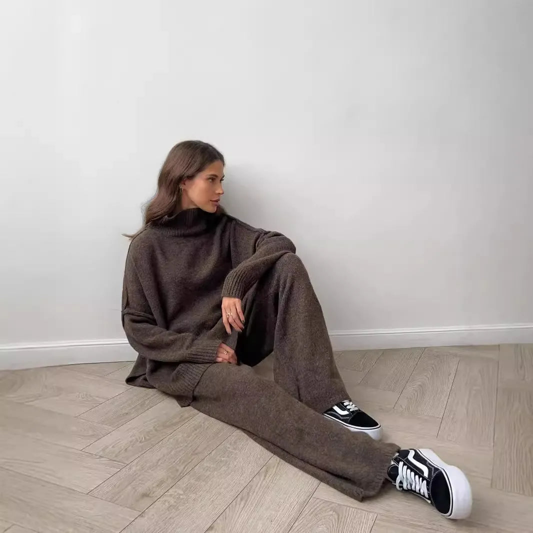 Women's dark grey acrylic sweater with side slits paired with matching trousers