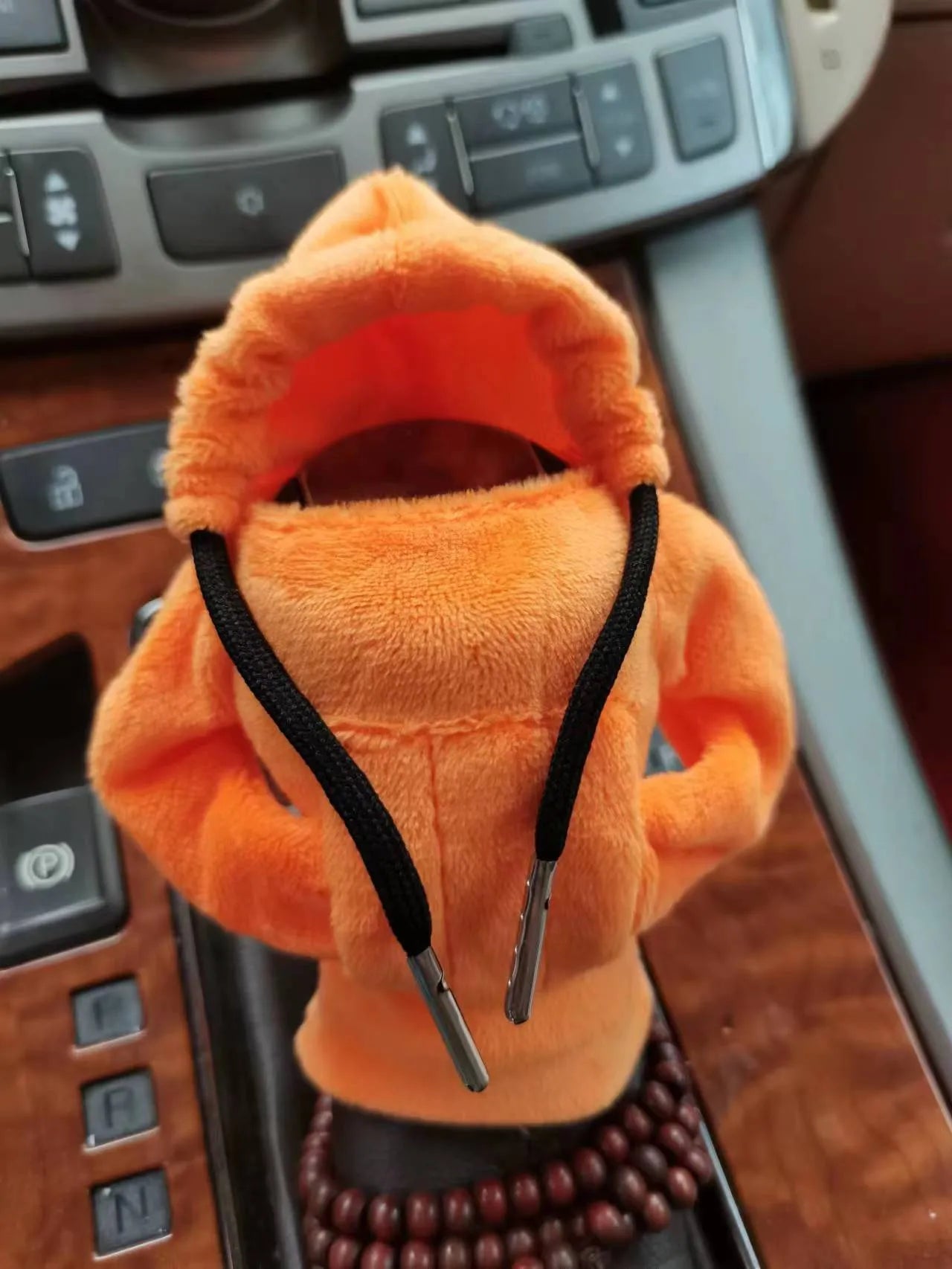 Dutch velvet car gear handle sleeve cover in multiple colours on a car gear lever.