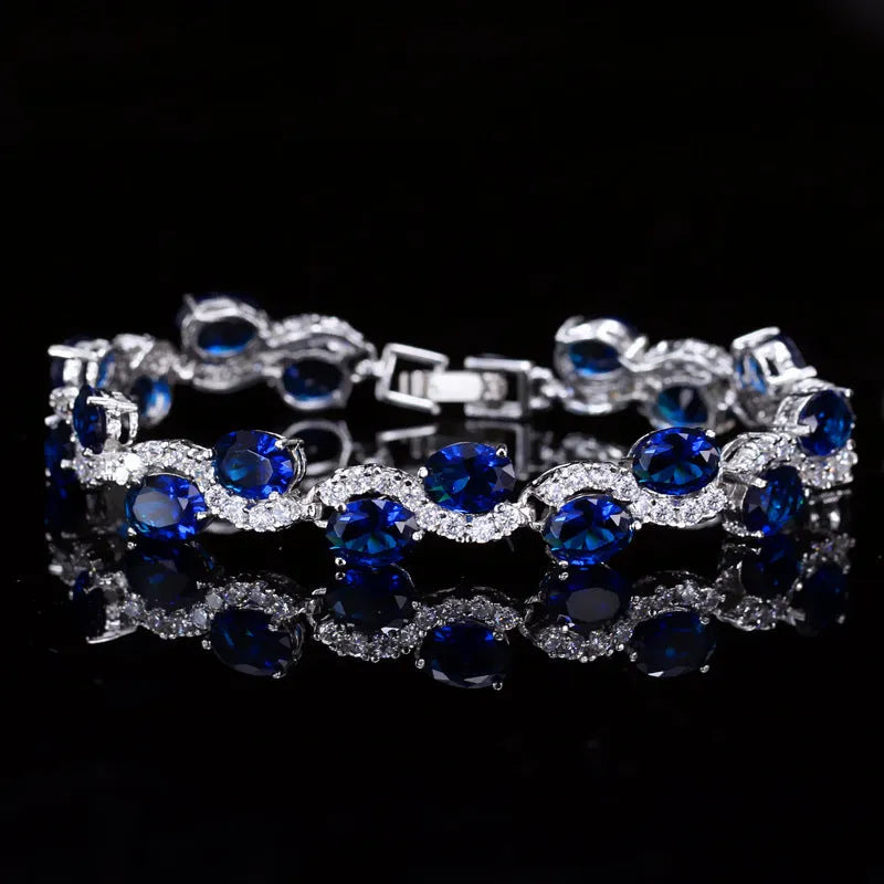Copper-plated bracelet with gold electroplating and zircon stones in geometric design