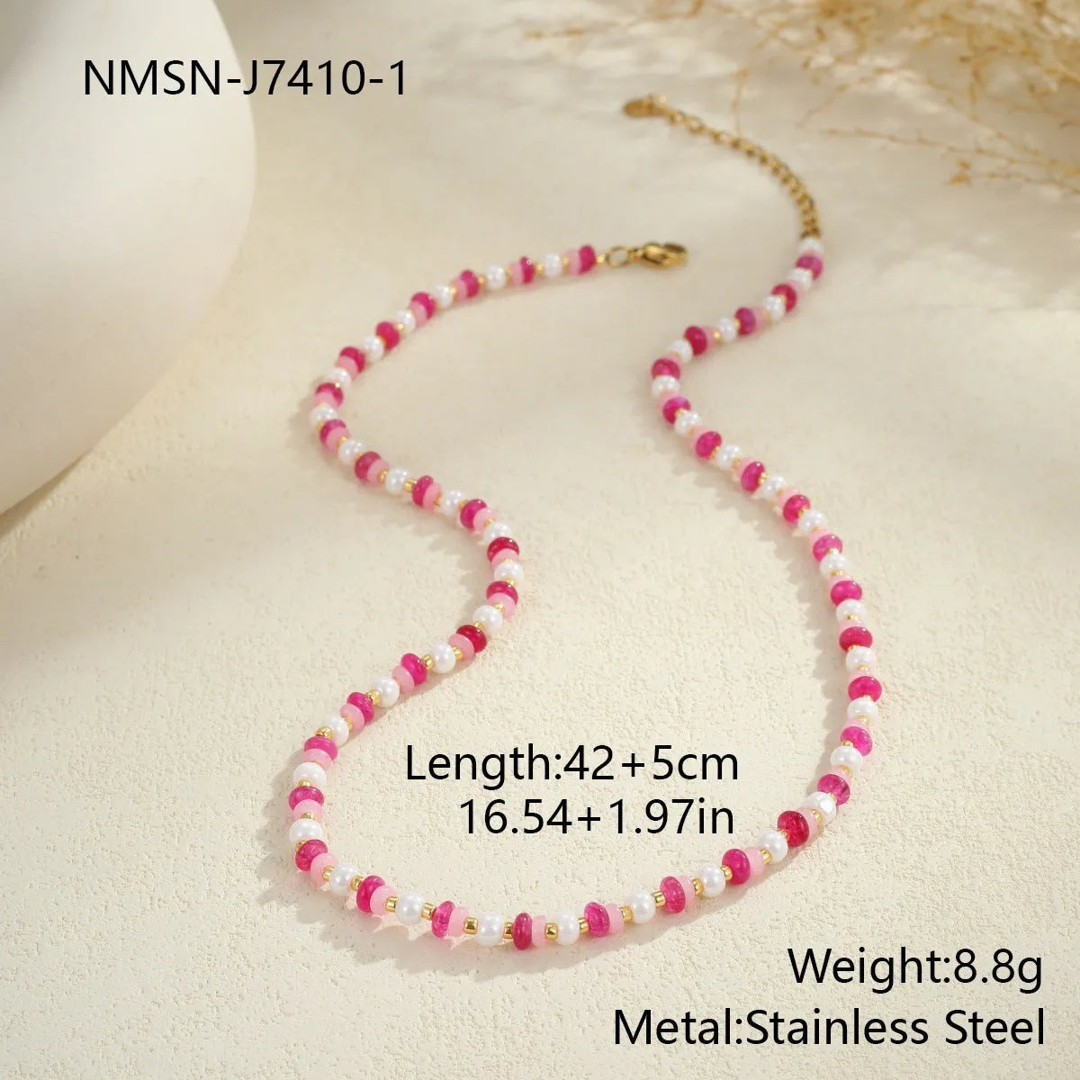 18K gold plated stainless steel chain necklace with pink electroplated resin bead pendant on white background