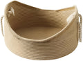 A square wicker cat bed basket with an integrated corrugated cardboard scratching panel on one side.