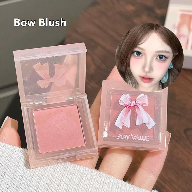 Butterfly Box makeup set showing four lip muds, powder blusher and matching necklace
