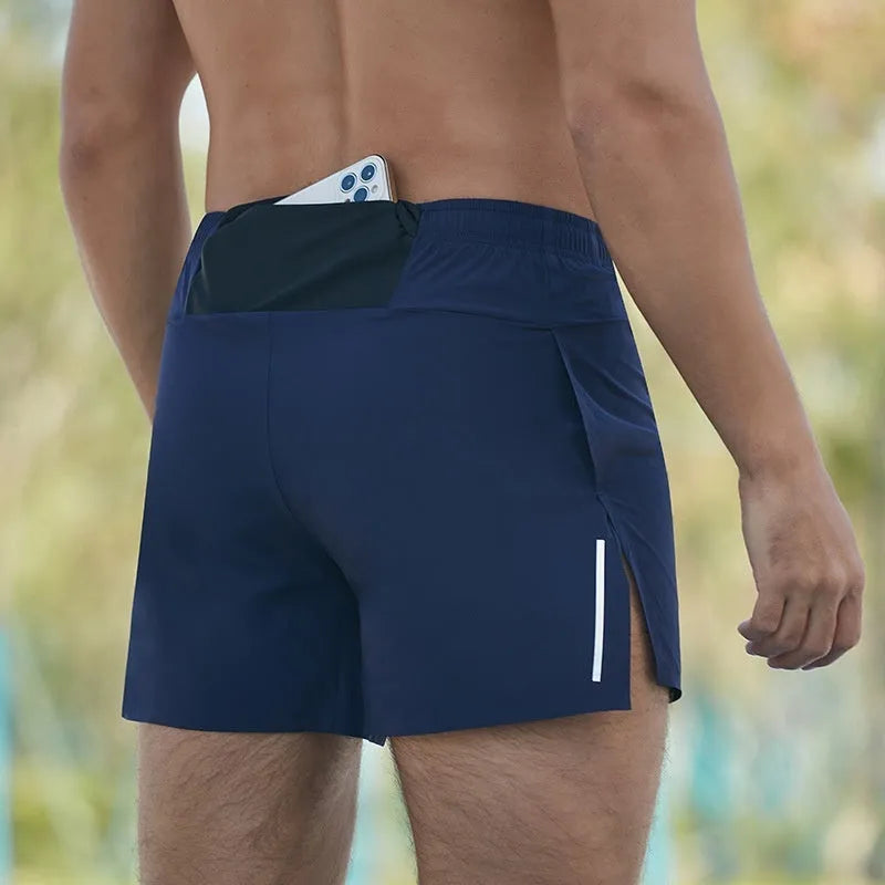 Men's loose fit off-road running shorts in grey, shown from front, with high waist and quick-dry fabric.