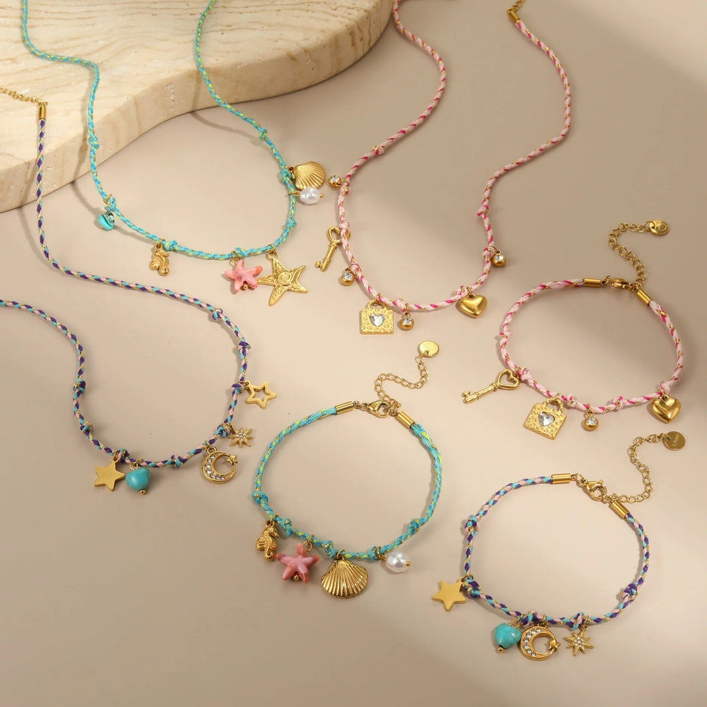 Handmade braided rope titanium steel necklace and bracelet set with 18K gold electroplated heart, star, and geometric pendants.